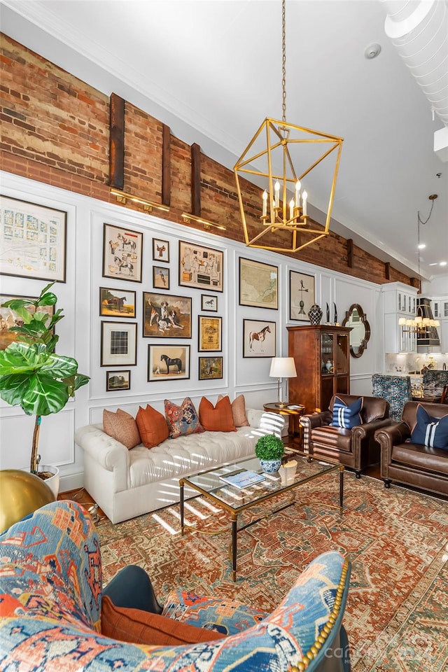 living room featuring crown molding, vaulted ceiling, and a chandelier