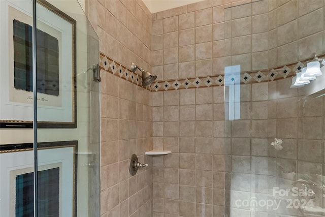 bathroom with tiled shower