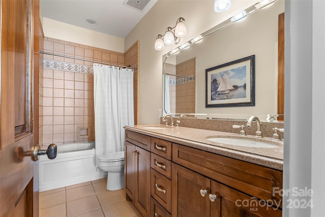 full bathroom with toilet, shower / bath combo, vanity, and tile patterned floors