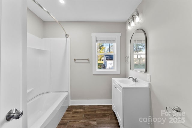 bathroom featuring shower / tub combination and vanity