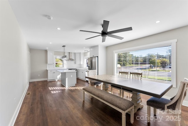 dining space featuring dark hardwood / wood-style floors and ceiling fan