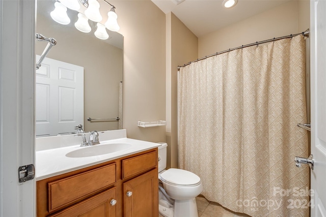 bathroom featuring vanity, curtained shower, toilet, and tile patterned flooring