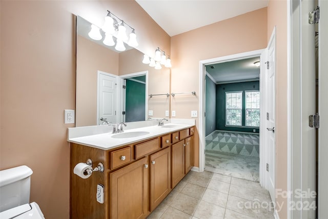 bathroom featuring vanity, toilet, and tile patterned flooring