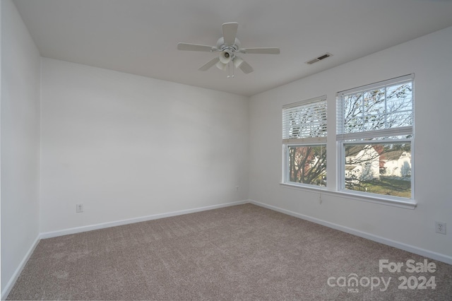 unfurnished room with carpet floors and ceiling fan