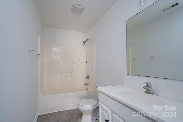 full bathroom with vanity, toilet, tile patterned floors, and bathing tub / shower combination