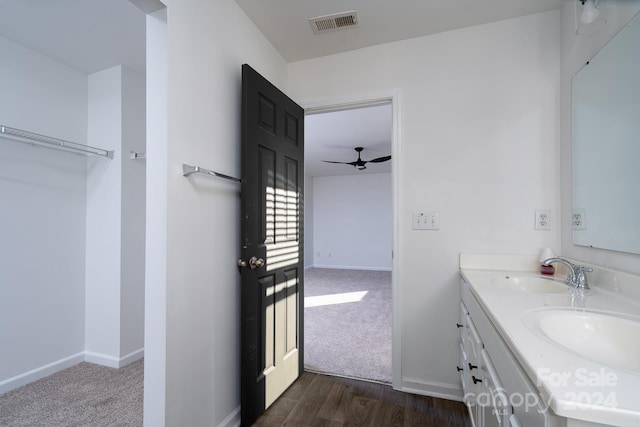 bathroom featuring vanity, wood-type flooring, and ceiling fan