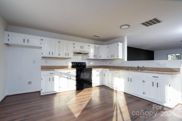 kitchen featuring dishwasher, dark wood-type flooring, sink, black electric range, and white cabinetry