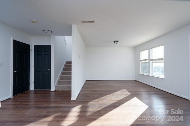 spare room featuring dark hardwood / wood-style flooring