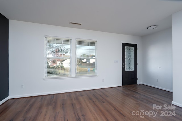 foyer with dark hardwood / wood-style floors