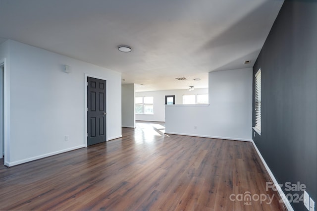 spare room featuring dark hardwood / wood-style flooring