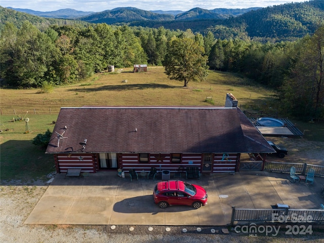 birds eye view of property with a mountain view