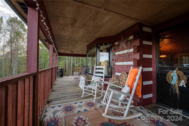 wooden deck featuring covered porch