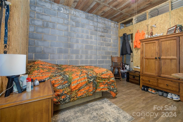 bedroom with hardwood / wood-style floors