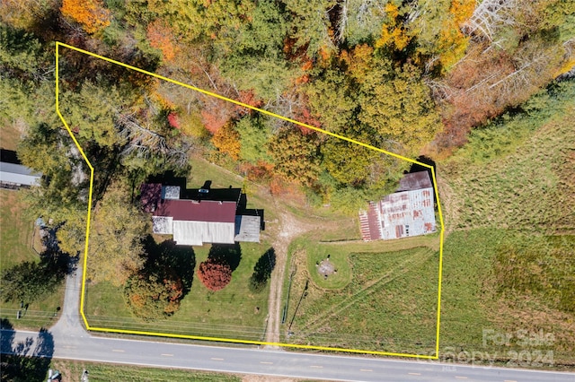 birds eye view of property featuring a rural view