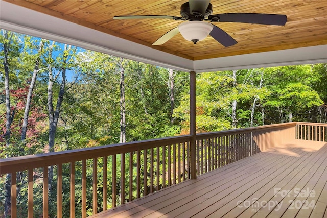 wooden terrace featuring a ceiling fan