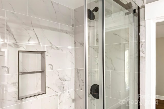 bathroom featuring an enclosed shower