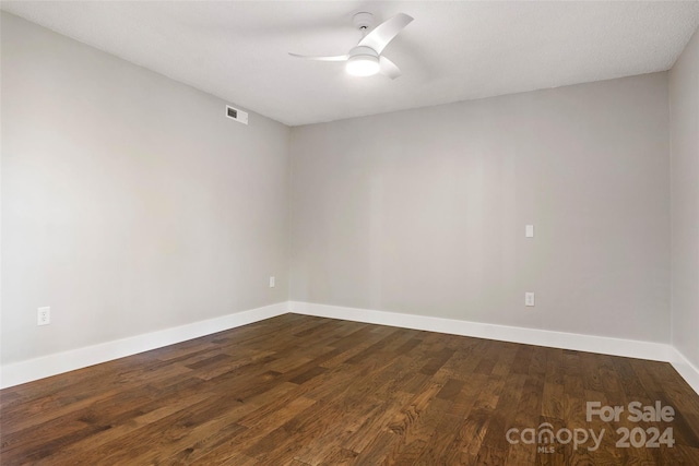 spare room with hardwood / wood-style flooring and ceiling fan