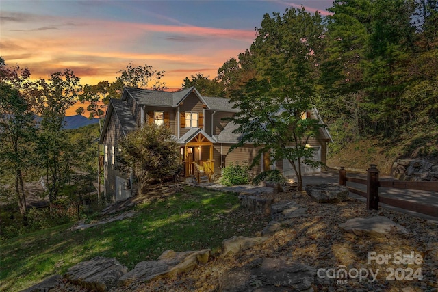 view of front of house featuring a mountain view and a garage