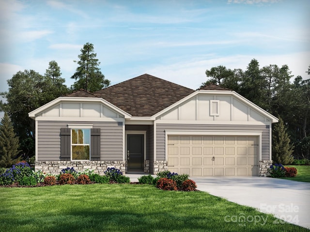 view of front of house with a front lawn and a garage