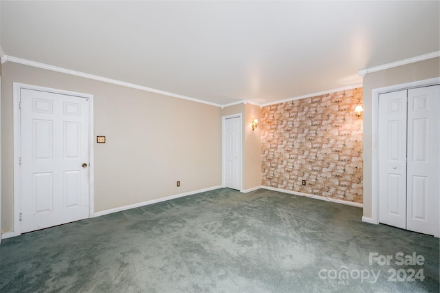 unfurnished bedroom featuring ornamental molding and dark colored carpet