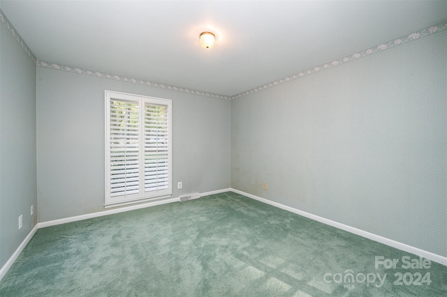 empty room featuring carpet flooring