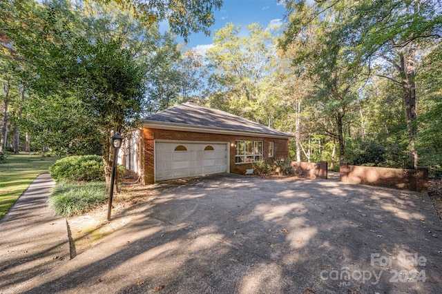 view of property exterior with a garage