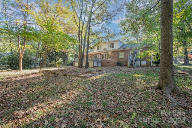 view of yard with a wooden deck