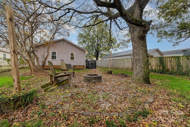 view of yard with an outdoor fire pit