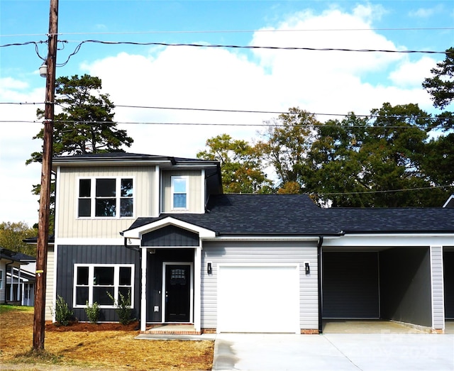 view of front of home featuring a garage and a carport