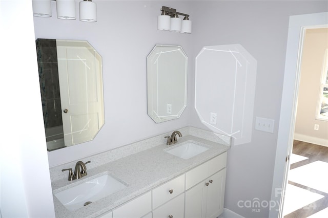 bathroom featuring vanity and wood-type flooring