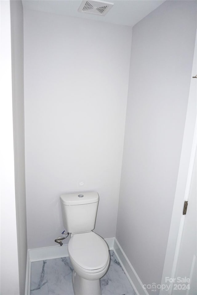 bathroom featuring toilet