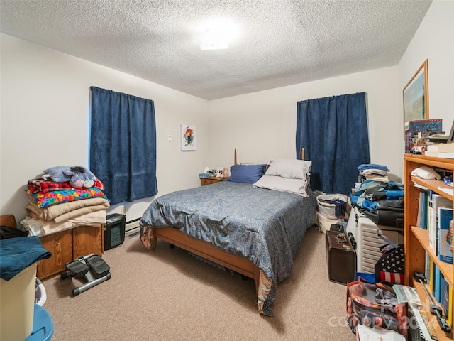 bedroom with a textured ceiling and carpet