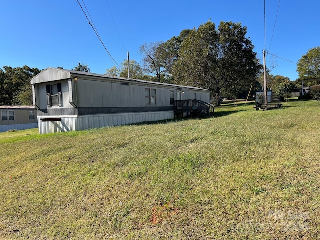 view of home's exterior with a lawn