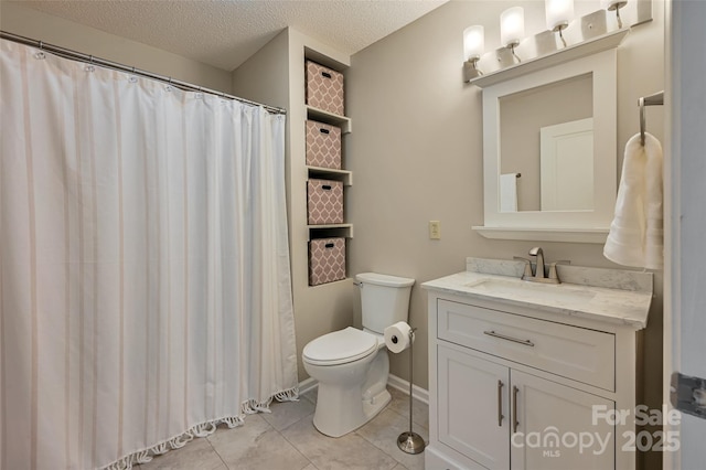 full bathroom with a textured ceiling, toilet, vanity, and tile patterned floors