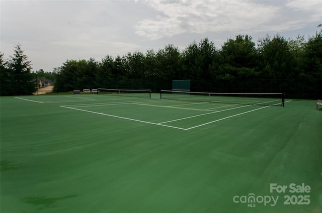 view of sport court with fence