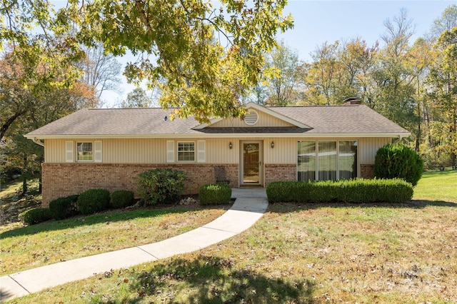 ranch-style house with a front lawn