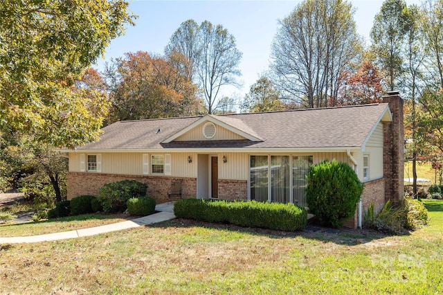 ranch-style house with a front yard