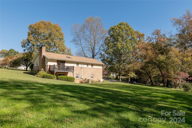 back of house with a yard