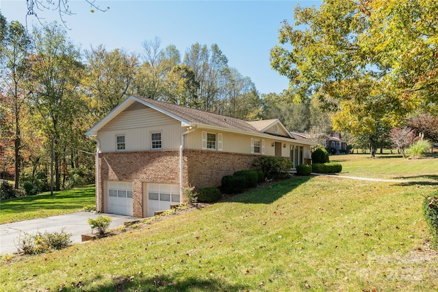 view of home's exterior with a garage and a lawn