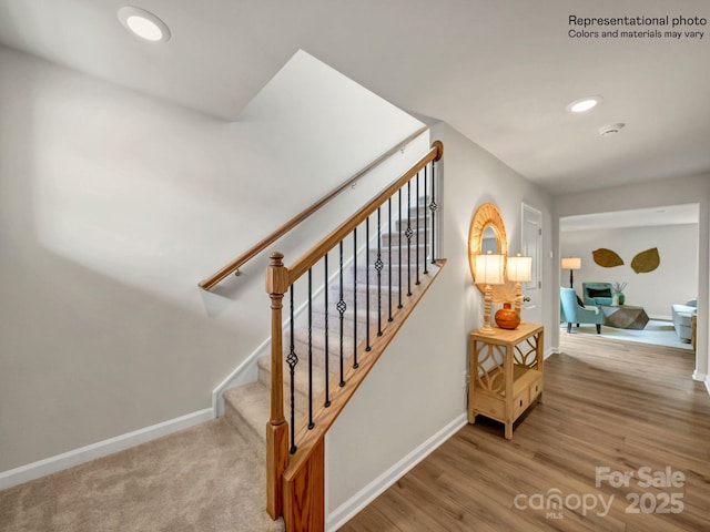 stairway featuring hardwood / wood-style floors