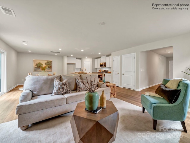 living room featuring light wood-type flooring