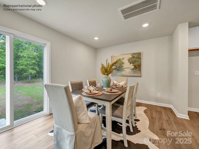 dining area with light hardwood / wood-style flooring