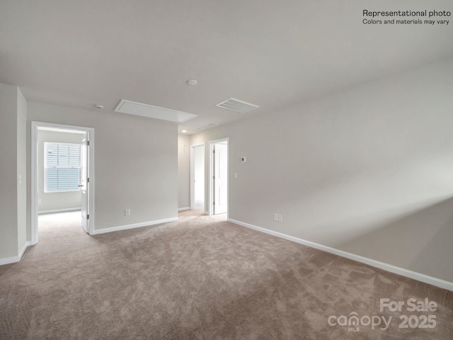 unfurnished room featuring carpet