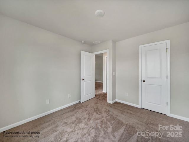 unfurnished bedroom featuring carpet flooring