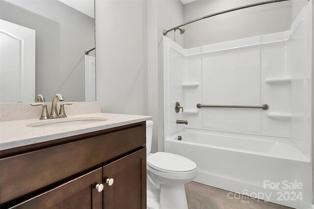 full bathroom featuring vanity, shower / tub combination, toilet, and tile patterned floors