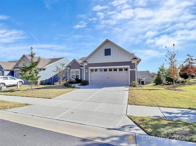 view of front of home featuring a front yard and a garage