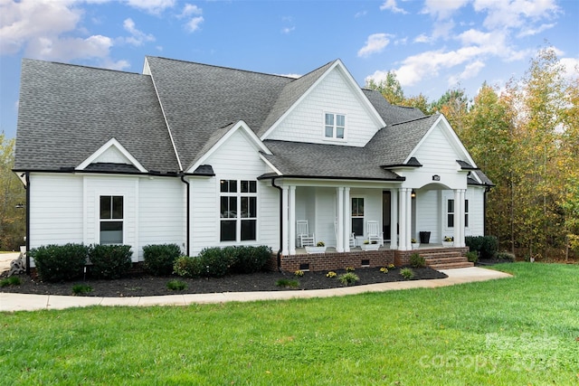 view of front of property with a front lawn and covered porch