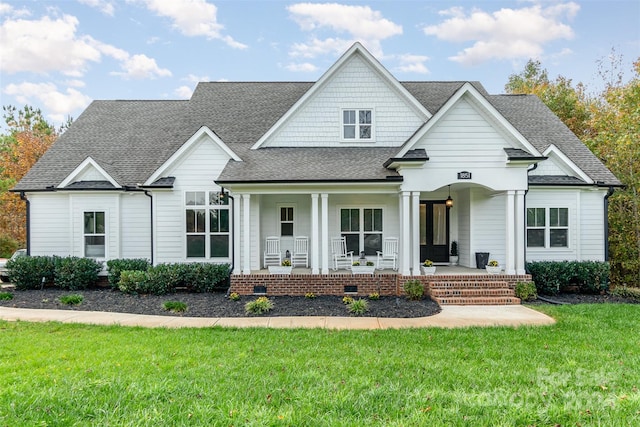 view of front of home featuring a front yard and a porch