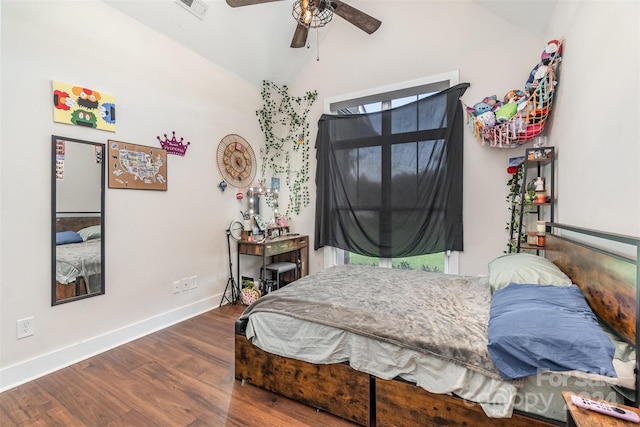 bedroom with ceiling fan, lofted ceiling, and hardwood / wood-style floors