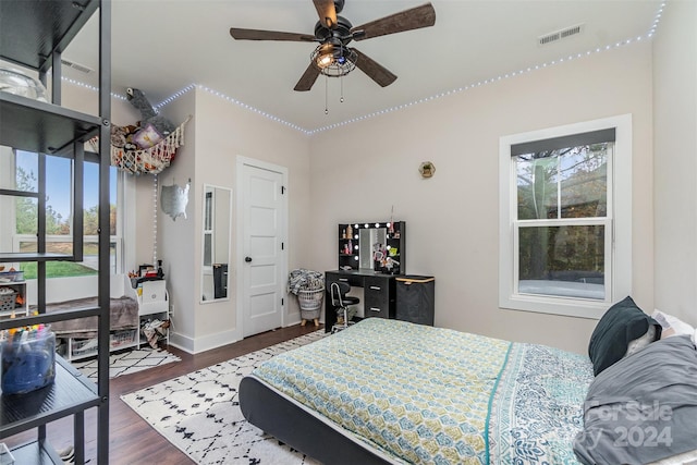 bedroom with dark wood-type flooring and ceiling fan